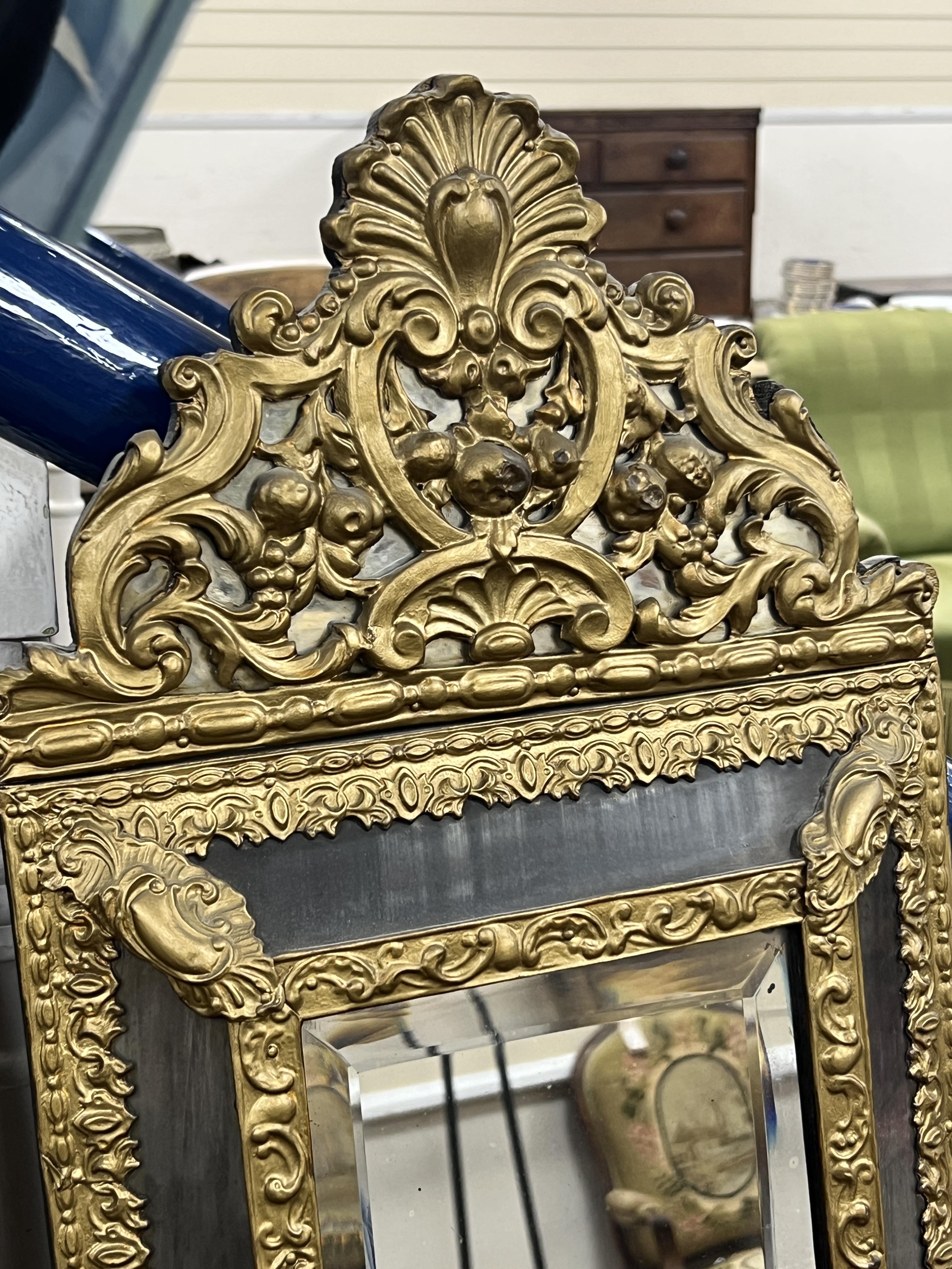 A pair of 19th century Dutch repousse wall mirrors, width 33cm, height 60cm